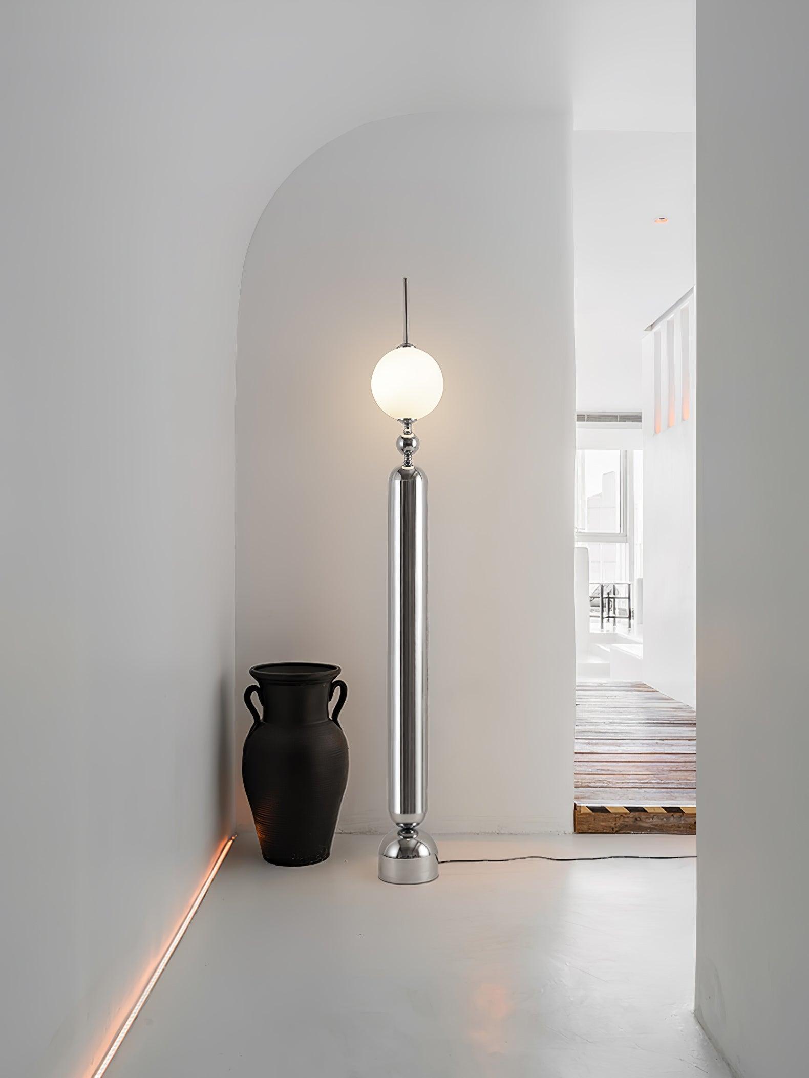 Lightning Rod chrome floor lamp with a white globe and vertical light strip