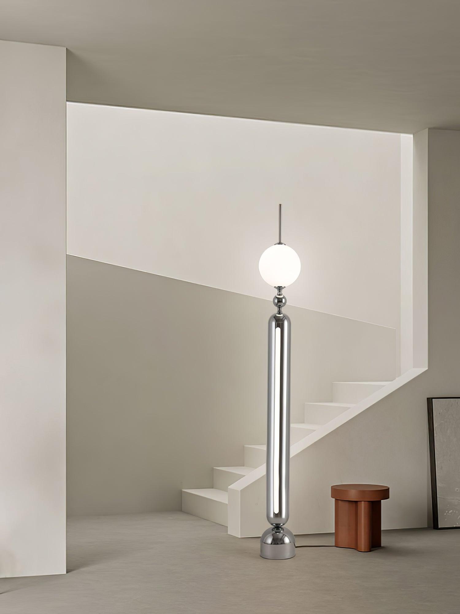 Lightning Rod chrome floor lamp with a white globe and vertical light strip
