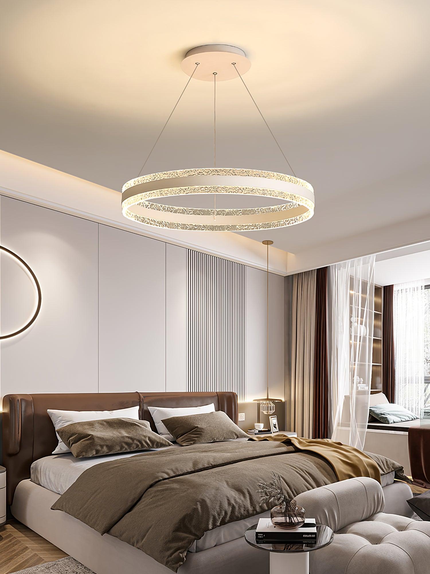 Single illuminated textured ring above a brown bed near curtains and a built-in window bench