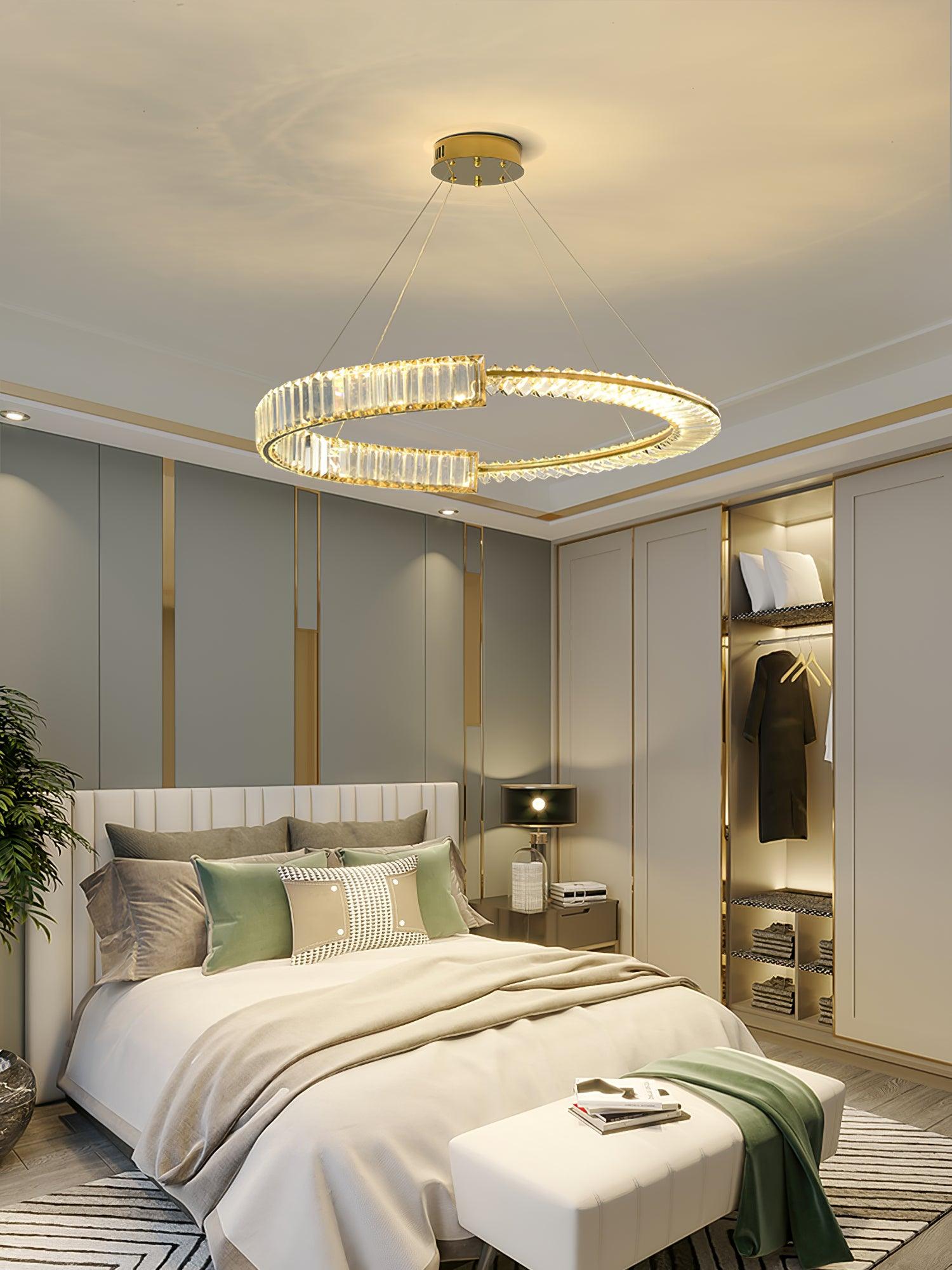 Stella Gold crystal chandelier above a bed
