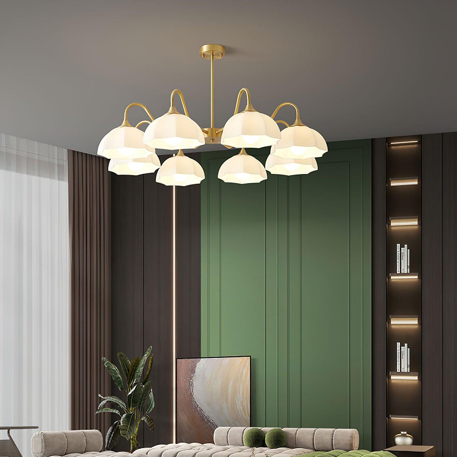 White glass chandelier in living room with green wall
