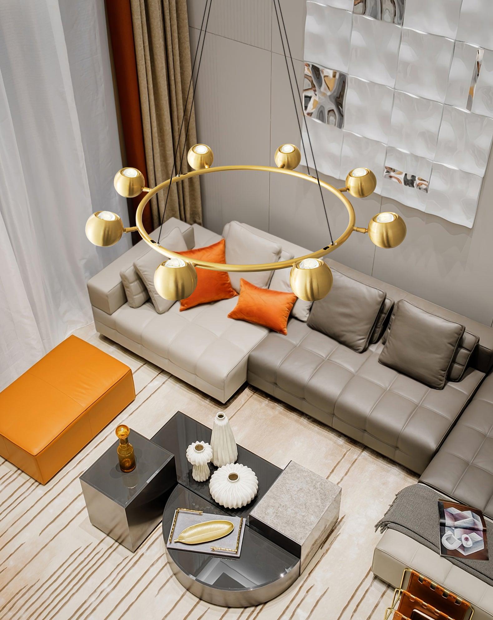 High room view of a ring chandelier above a sectional sofa