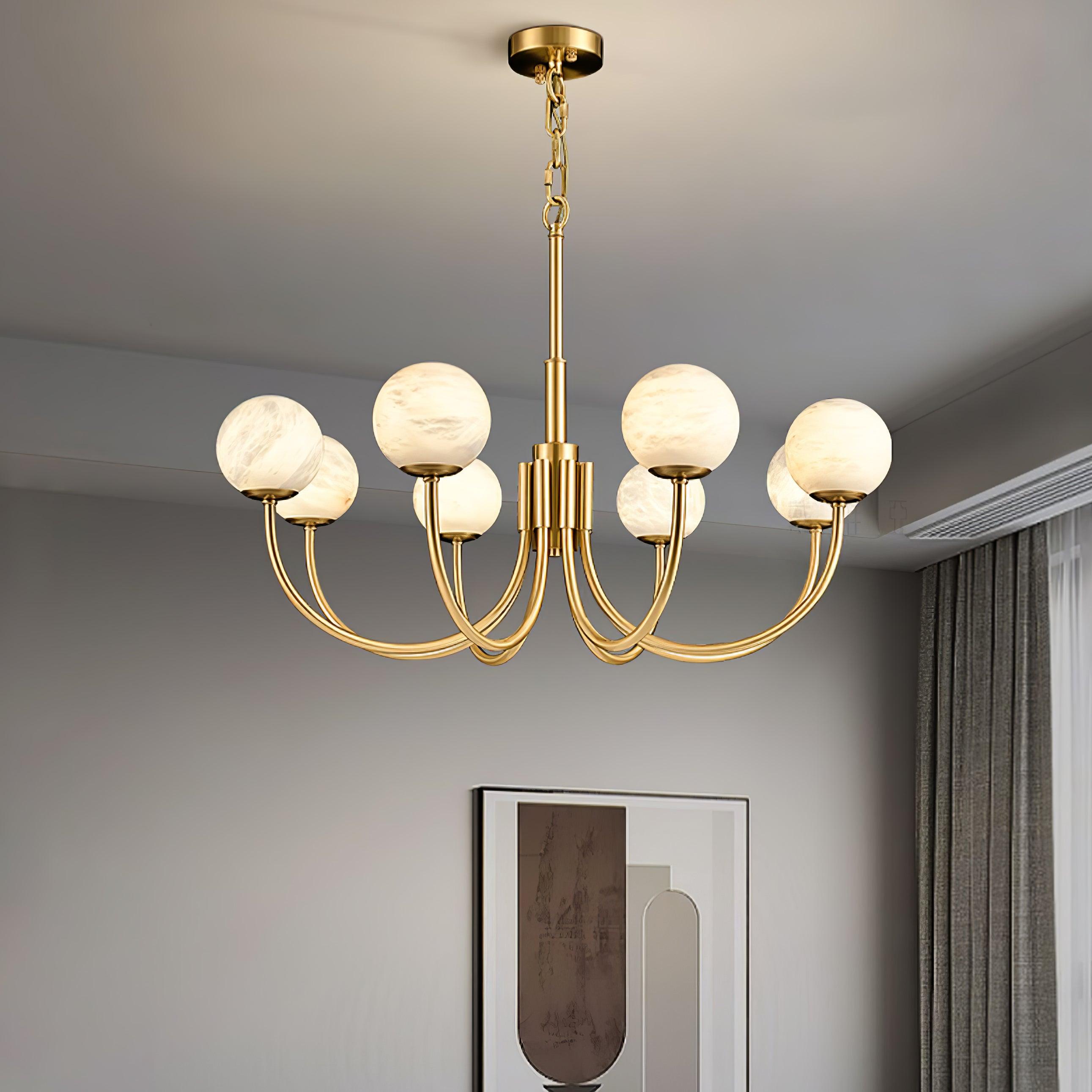 Six-globe brass chandelier in a neutral living room