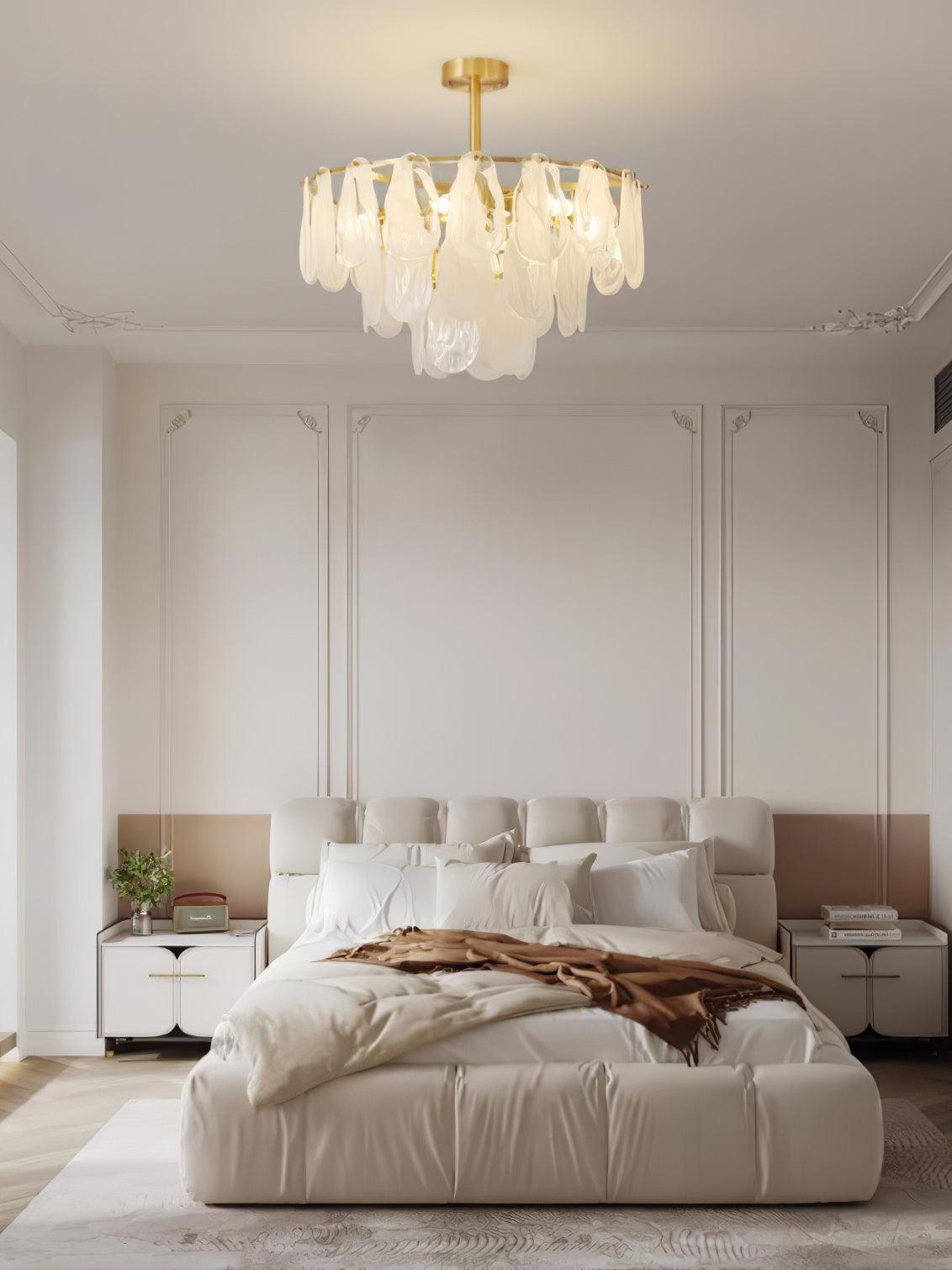 Round Cloud pendant in a bedroom with a cream headboard and bedside lamps