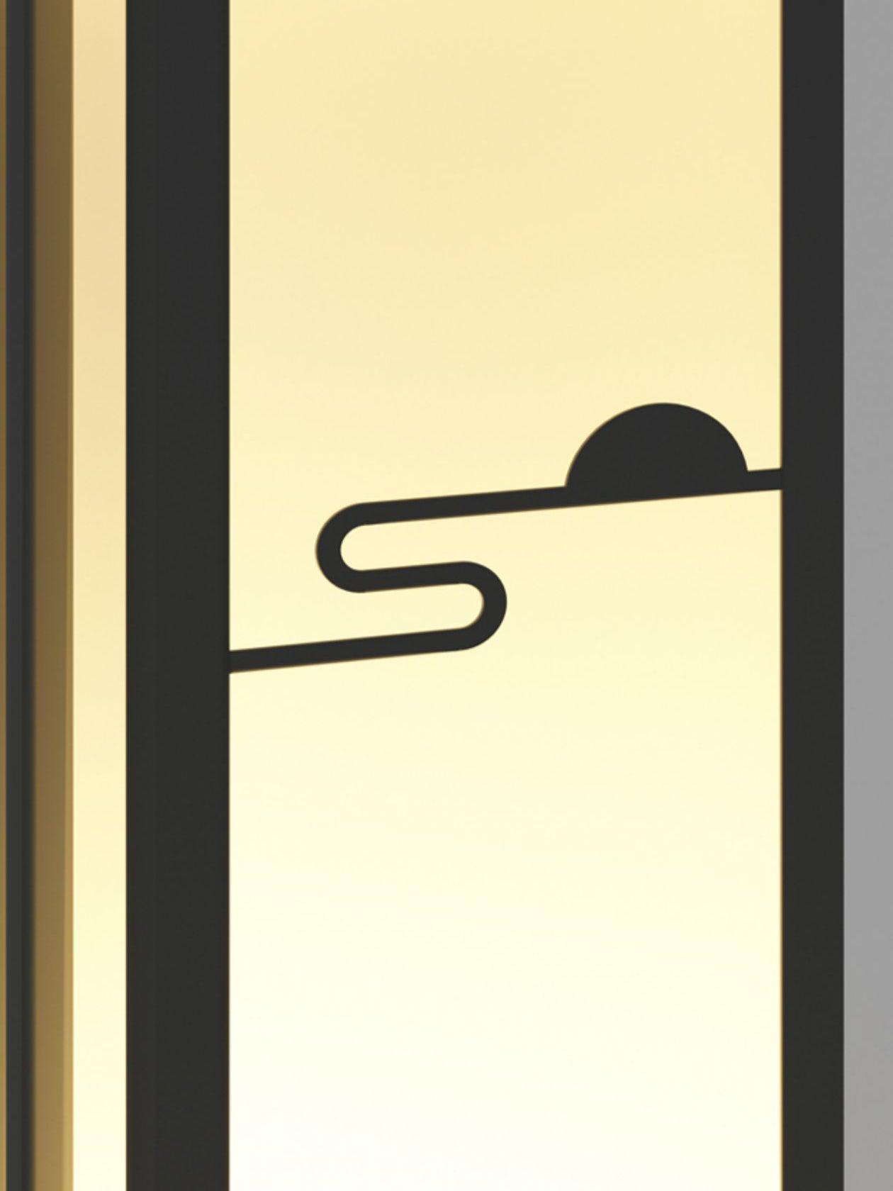 Close-up of semicircle sun and curling horizontal line on the illuminated front panel inside black frame