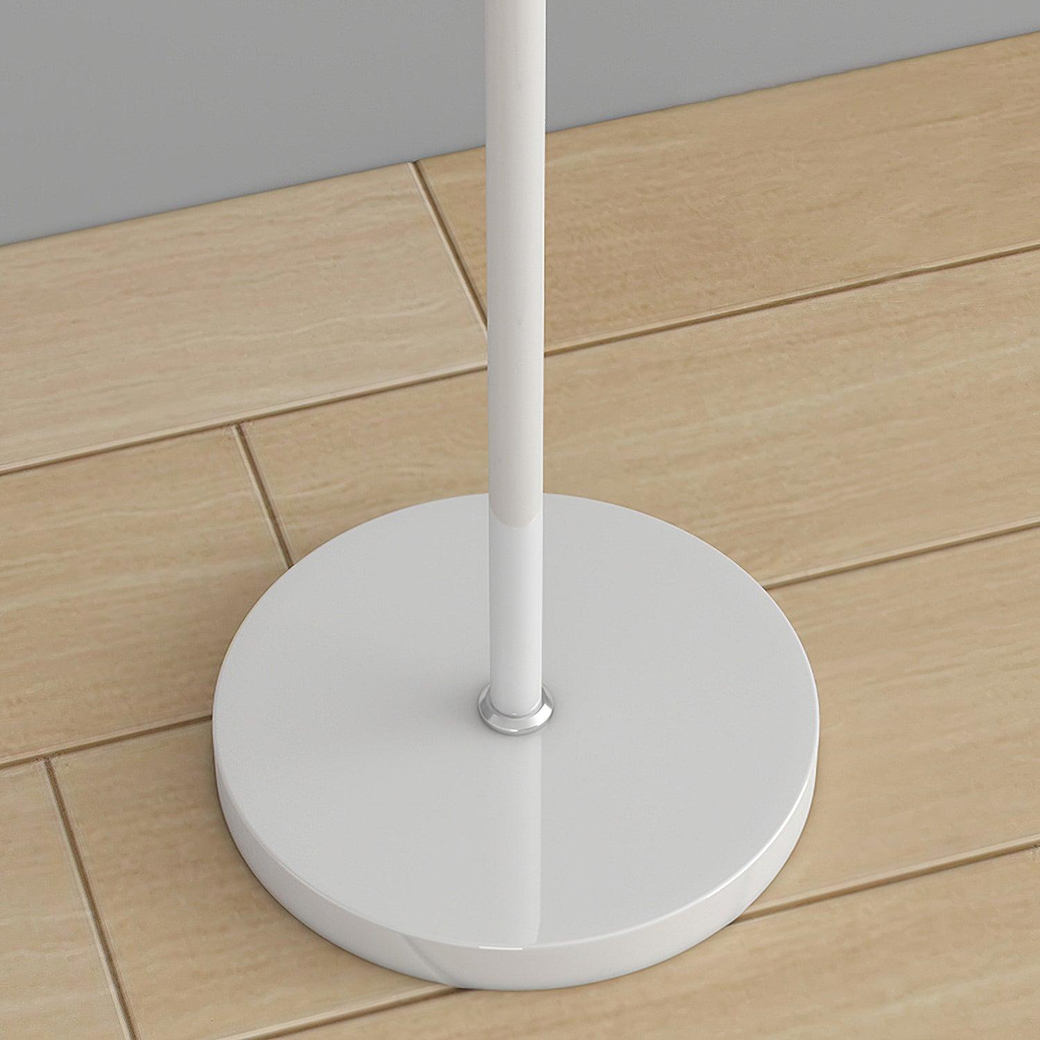 White circular lamp base and straight stem with a shiny collar, viewed from above on a wood-pattern floor
