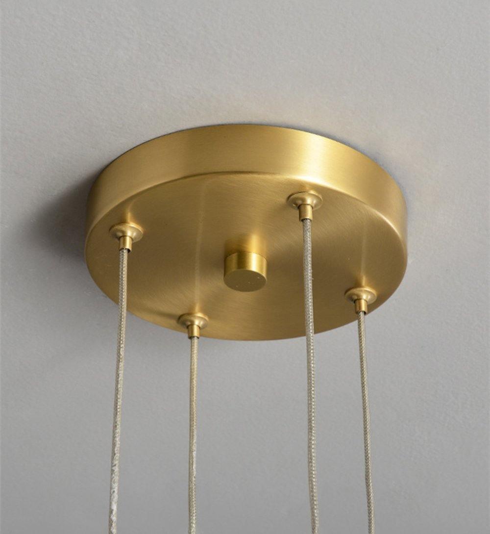 Parallel LED chandelier with textured acrylic bands and gold-tone connectors