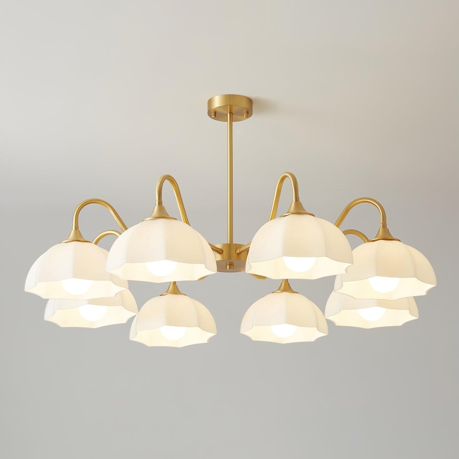 Wide brass chandelier with layered white glass shades