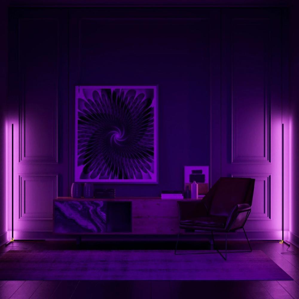 Two slim corner lamps shown casting purple light in a staged room with cabinet, artwork and chair