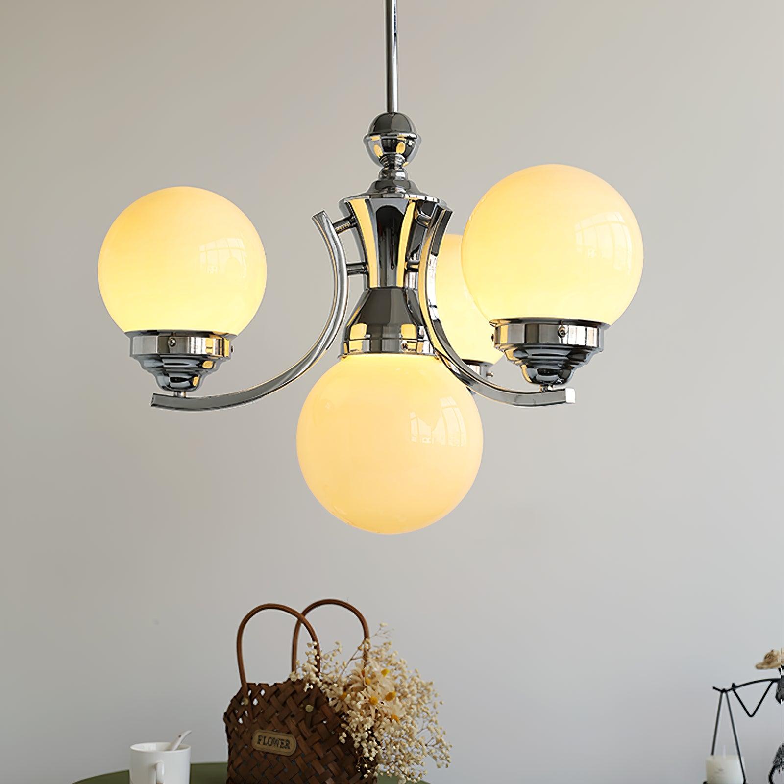 Compact Dewdrop with warm-looking globes and a central lower globe above a green table and flower basket