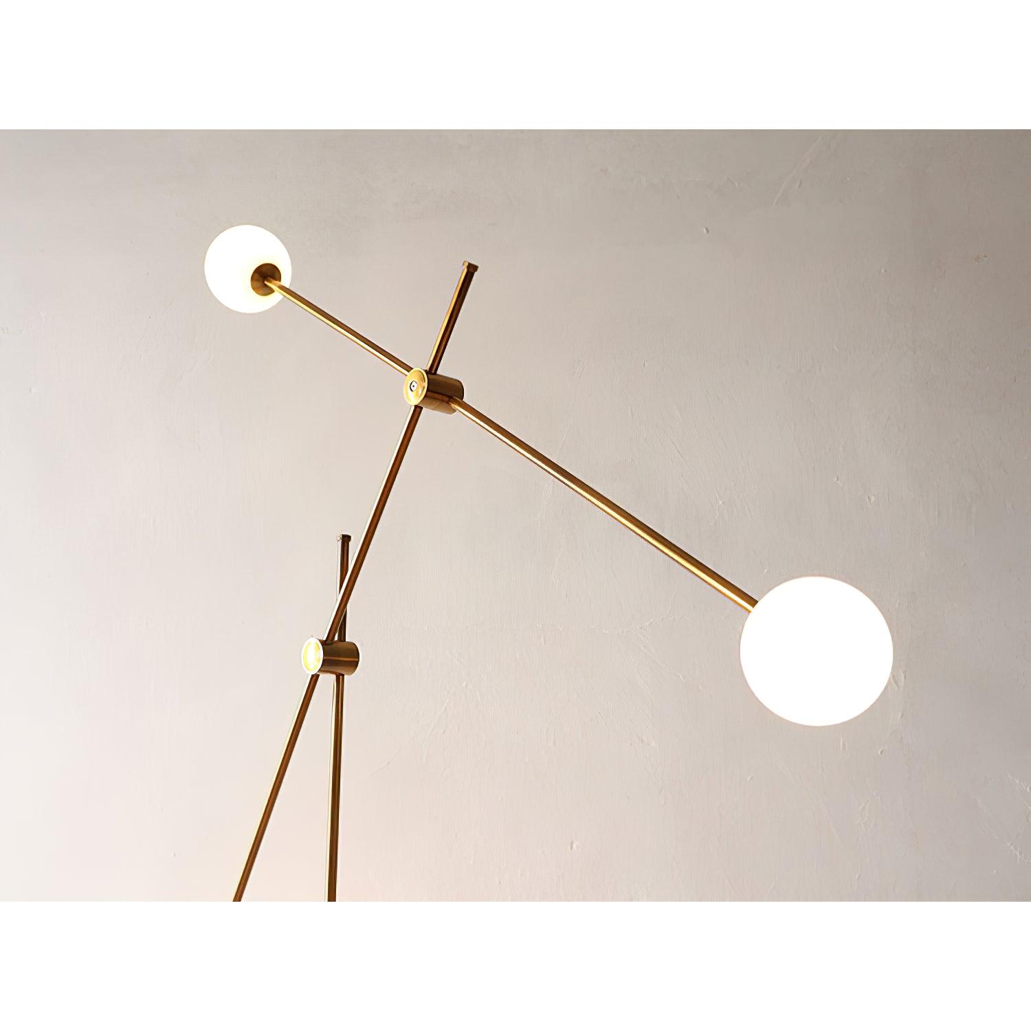 Detail of two glowing globes on Kemi’s upper gold bar and the circular joints where the rods meet