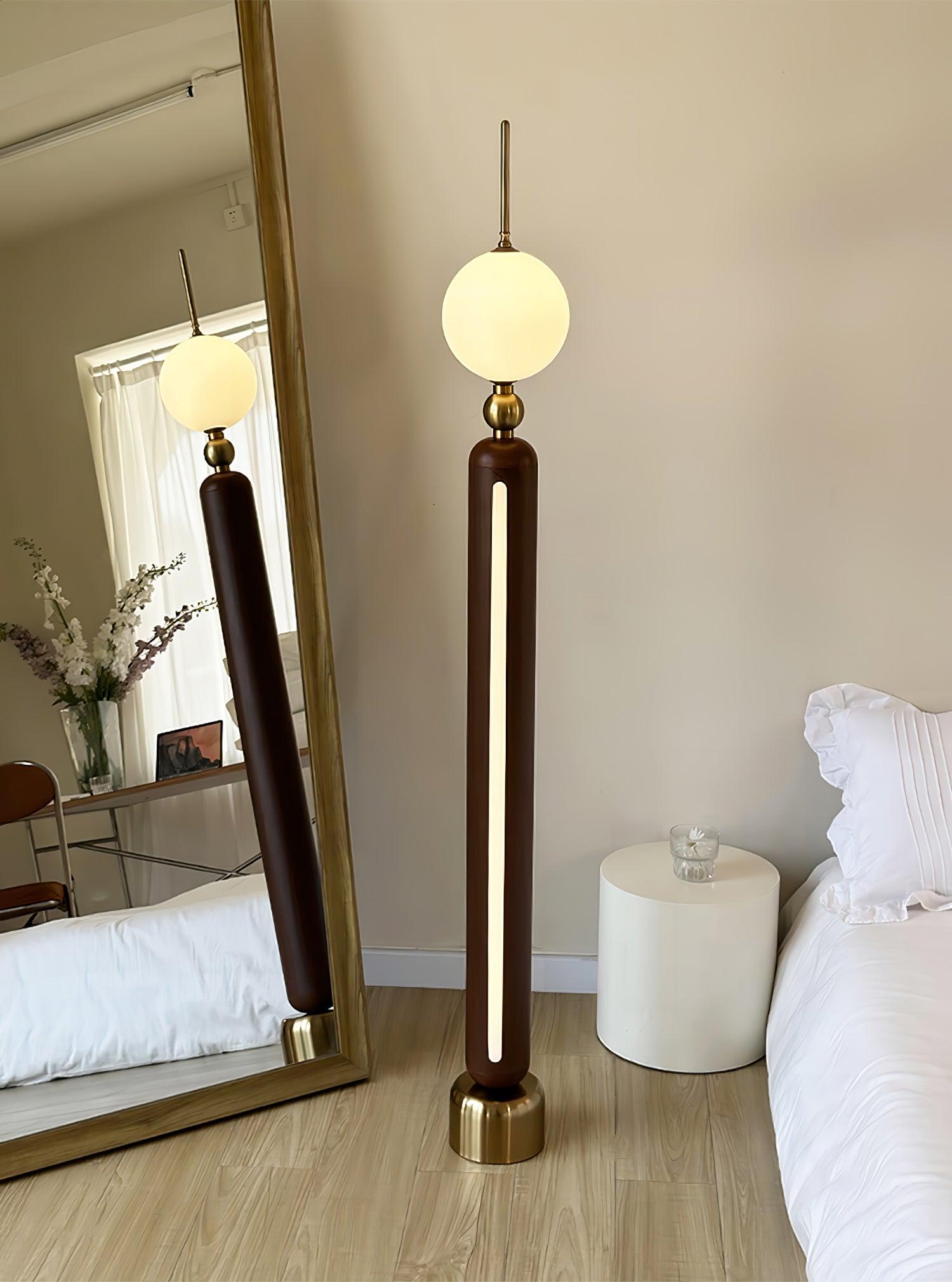 Lightning Rod chrome floor lamp with a white globe and vertical light strip