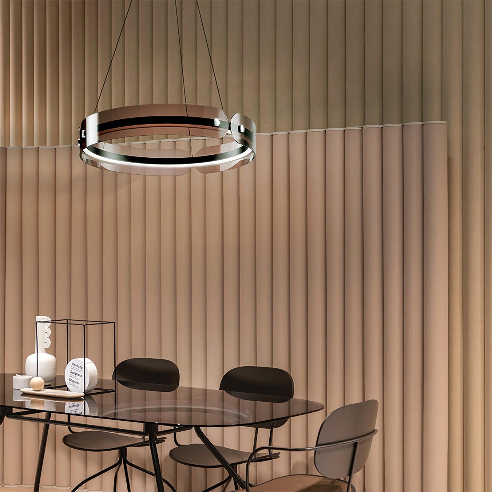 Javor ring with coffee-tinted panels above a dark glass dining table and black chairs by a beige fluted wall