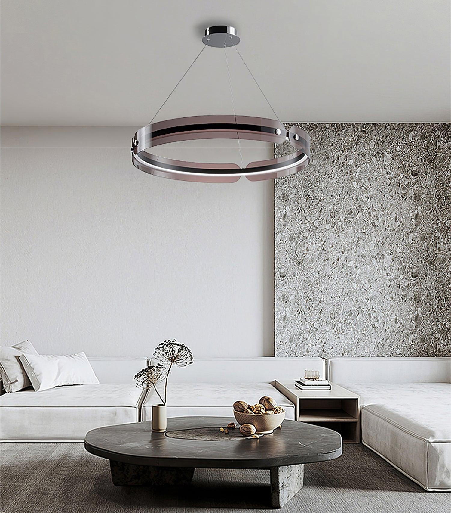 Javor black and coffee ring on three wires beneath a round canopy above a pale corner sofa and dark coffee table