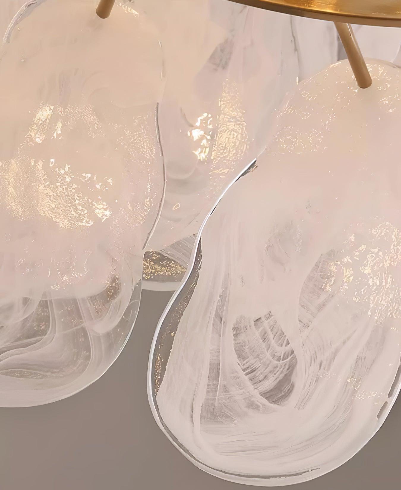 Close view of clear glass edges and cloudy white swirls on Round Cloud pendant panels
