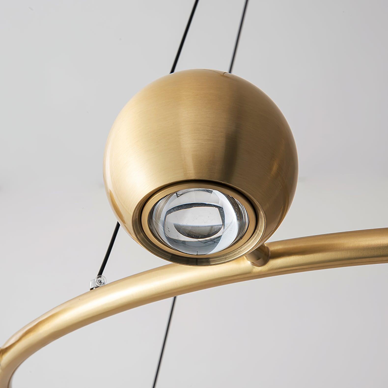 Close view of a spherical brass head and lens face