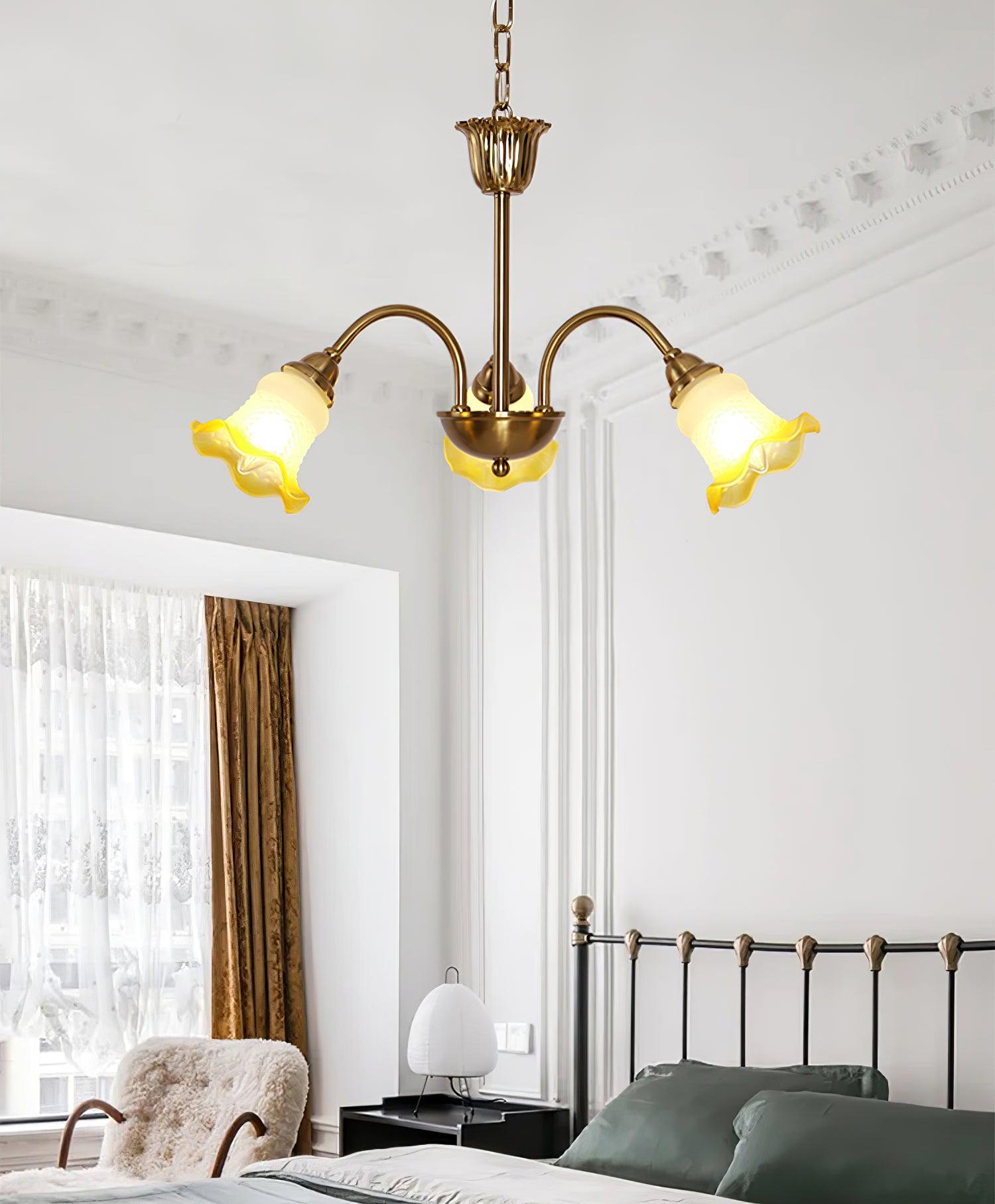 Three-head Yellow chandelier in a bedroom