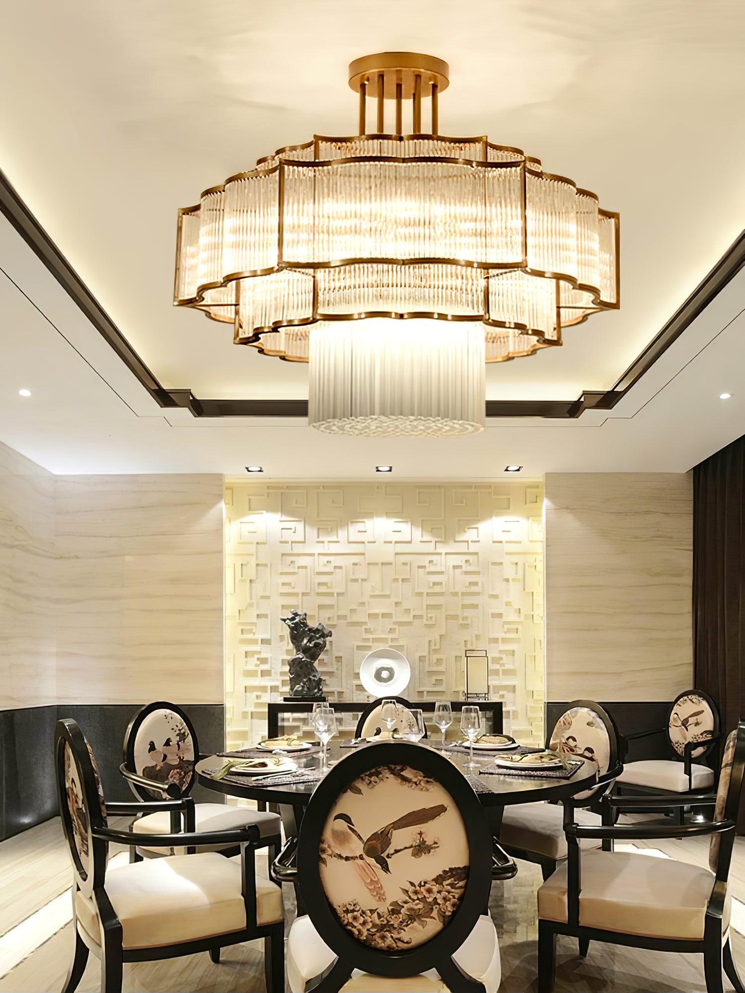 Pharo II tiered chandelier with clear ridged elements and a scalloped metal frame