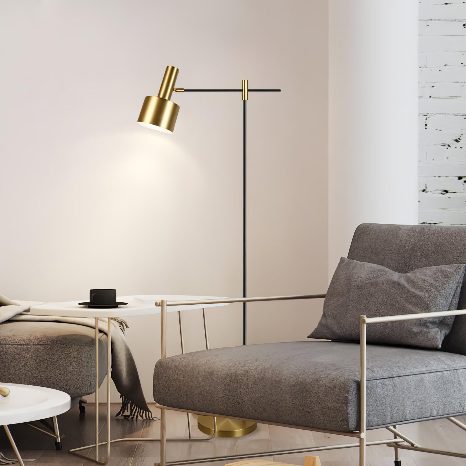 Closer view of lit gold-headed floor lamp beside grey lounge chair, black cup on side table and ottoman
