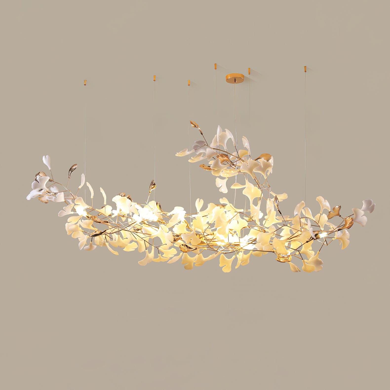 Model B white-and-gold leaf chandelier curving upward into a taller central sweep, on beige background