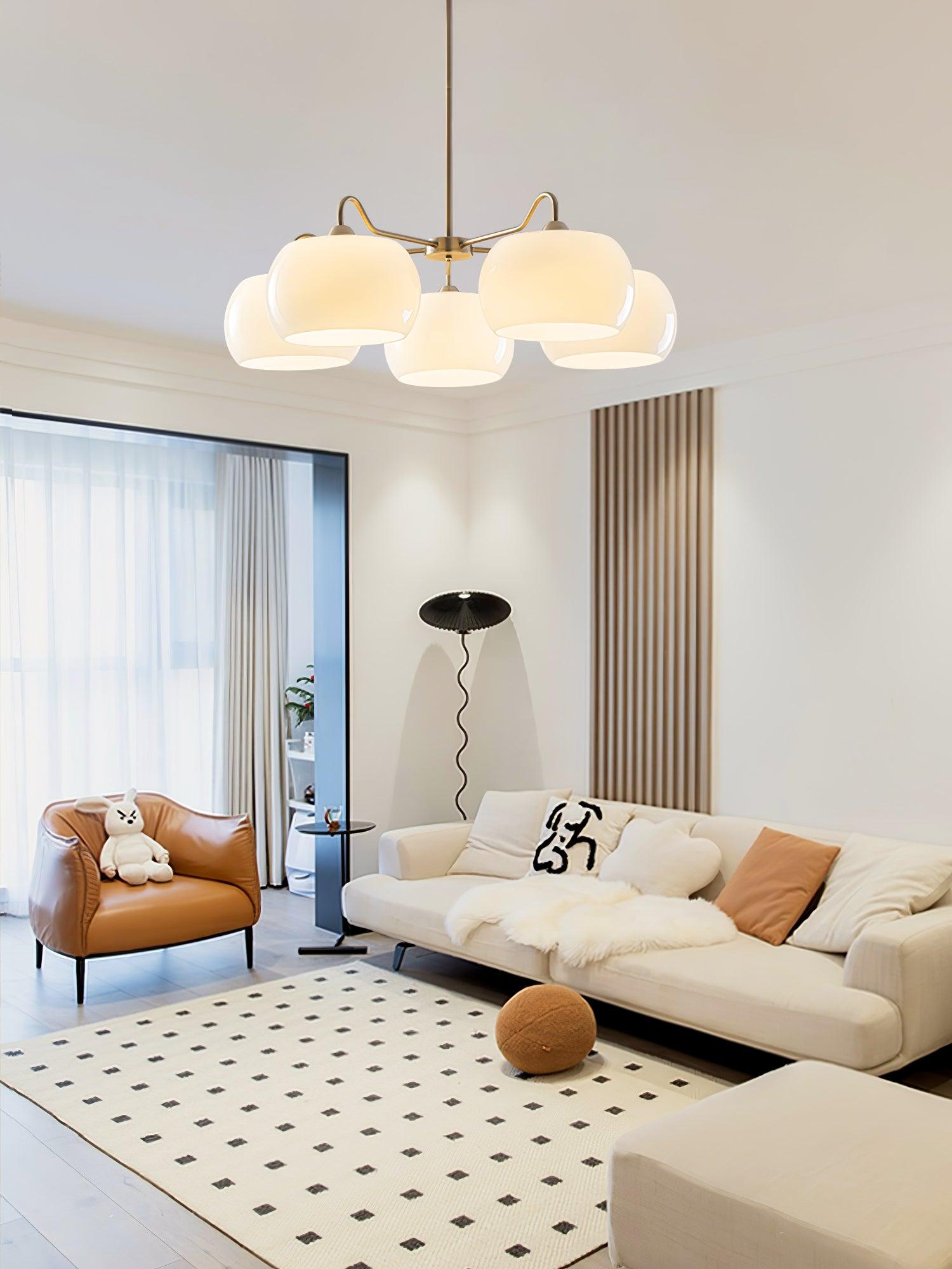 Persimmon chandelier with white glass shades and curved nickel-tone arms