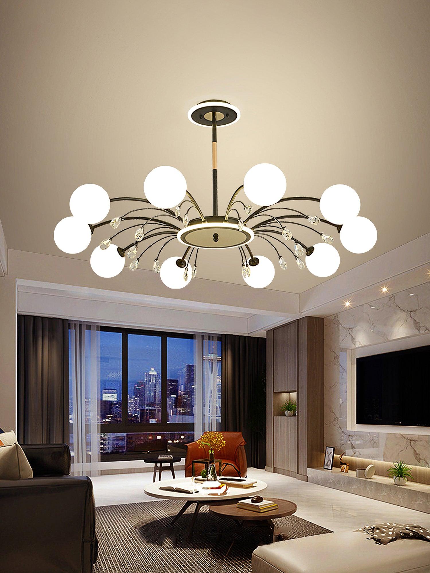 Black globe chandelier in evening living room with city-view window, marble television wall, orange chair and round wood table