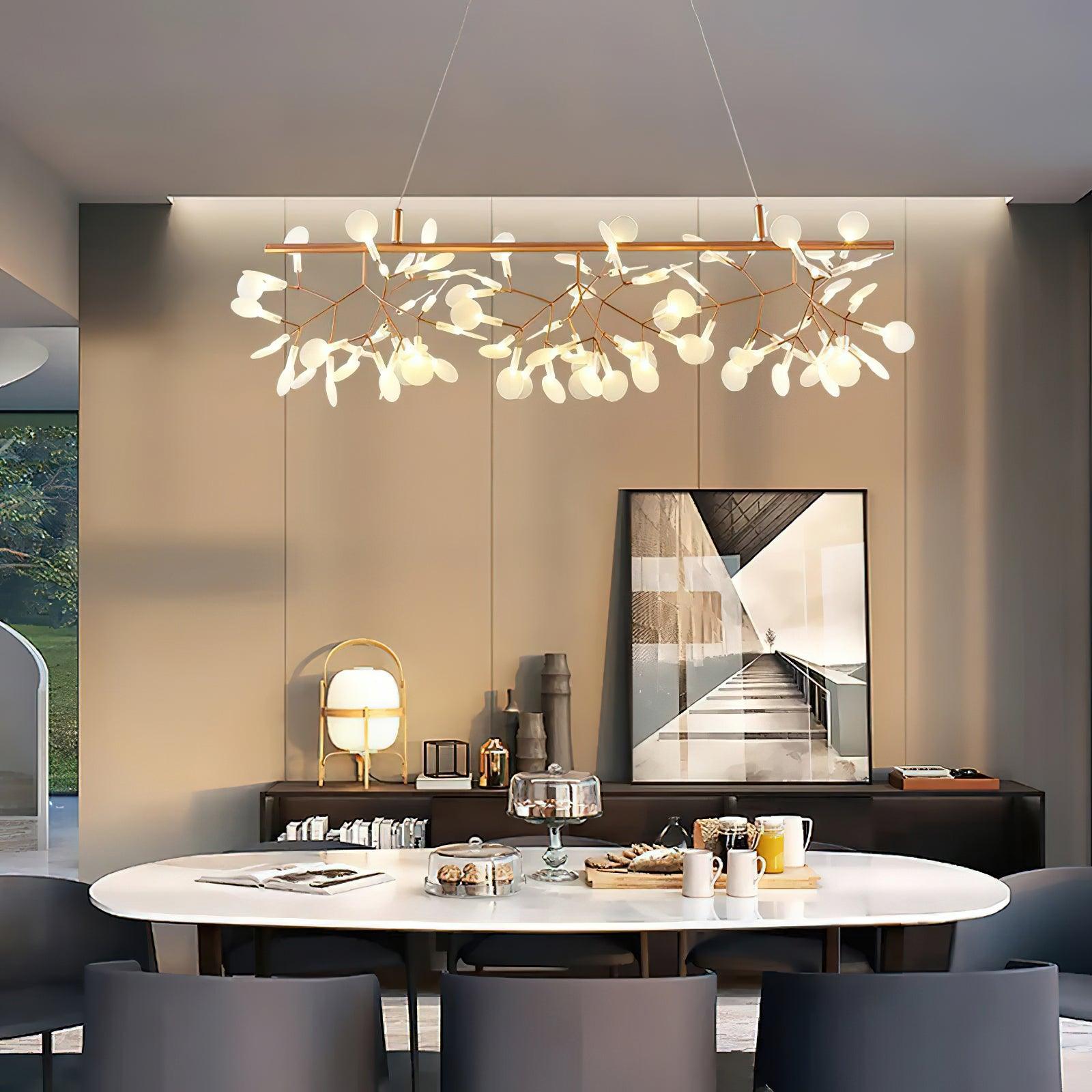 Illuminated linear petals above oval dining table and dark chairs, with sideboard, stair photograph and portable lamp