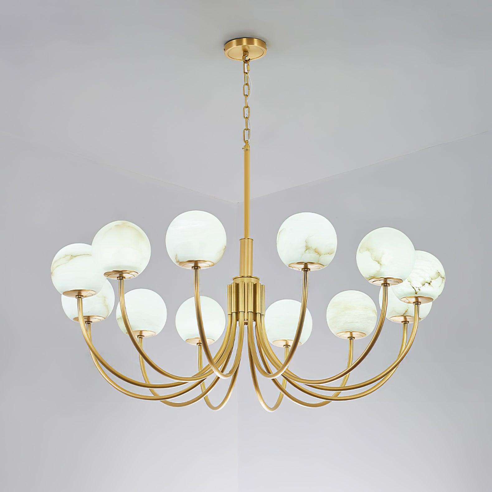 Aurelian brass chandelier with pale globes in a cool-lit view