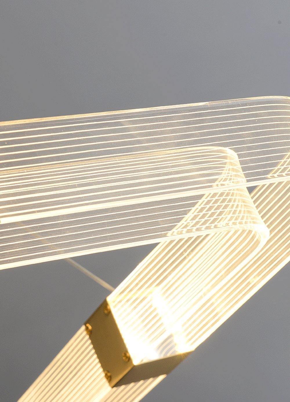 Parallel LED chandelier with textured acrylic bands and gold-tone connectors