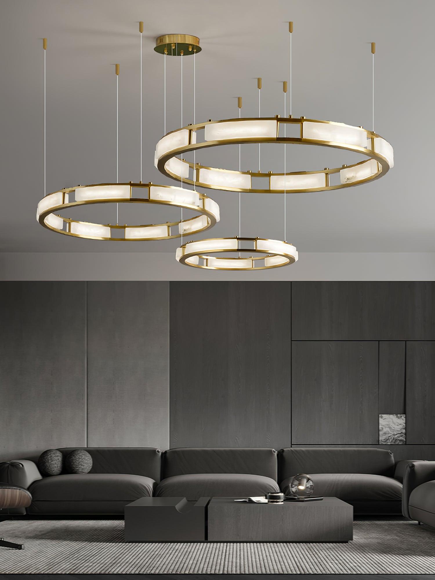 Several Qatar ring chandeliers arranged at different heights in a room