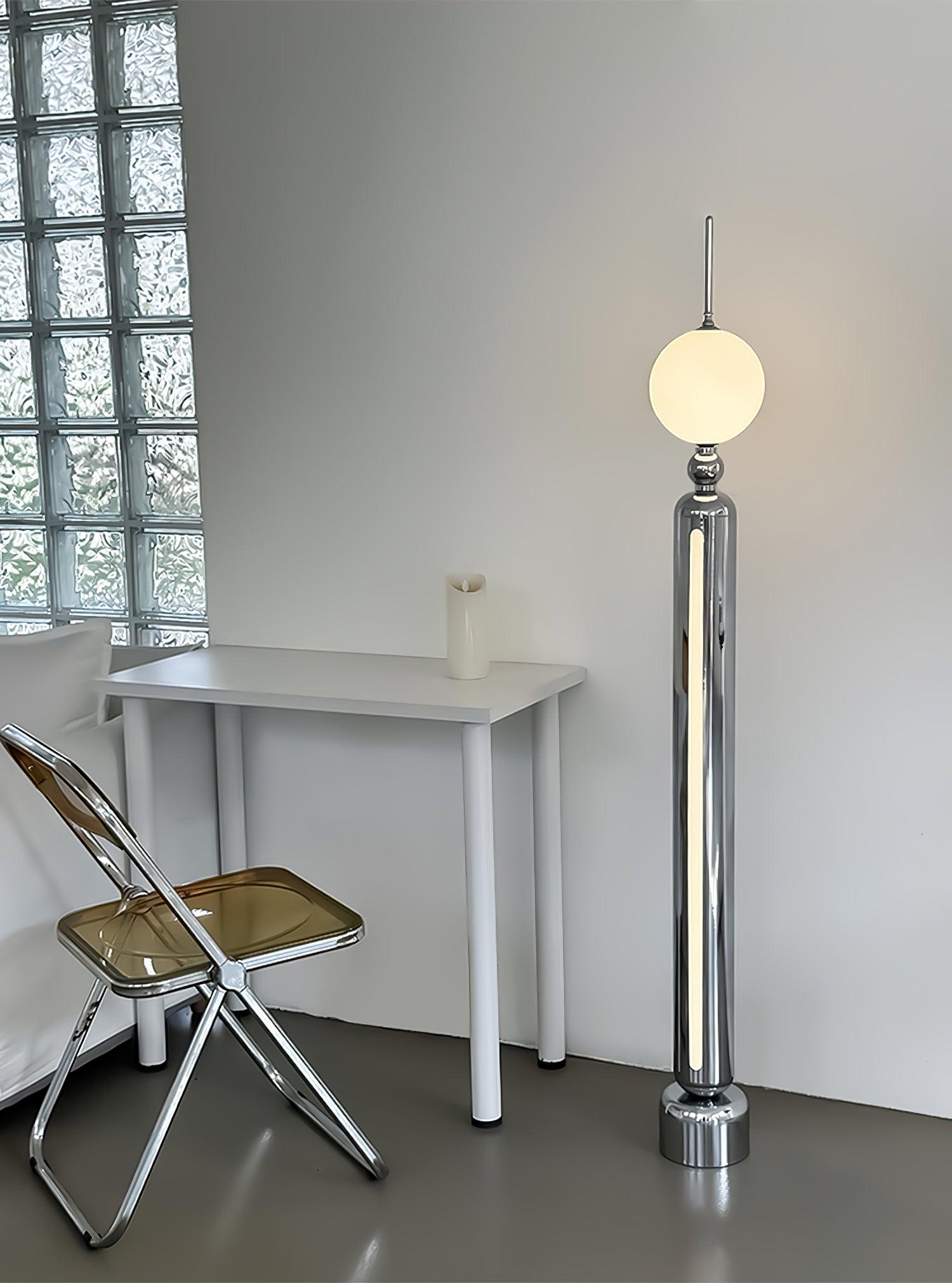 Lightning Rod chrome floor lamp with a white globe and vertical light strip