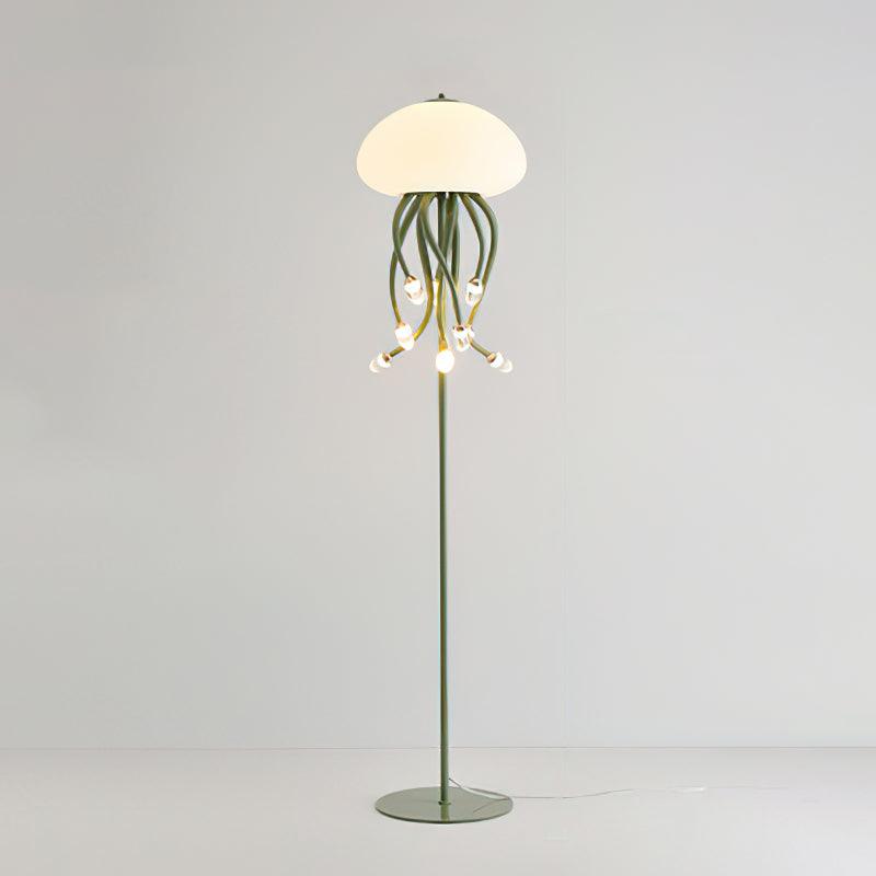 Green 9+1 Jellyfish floor lamp on pale background, with nine hanging droplet lights below dome, slim pole and circular base.
