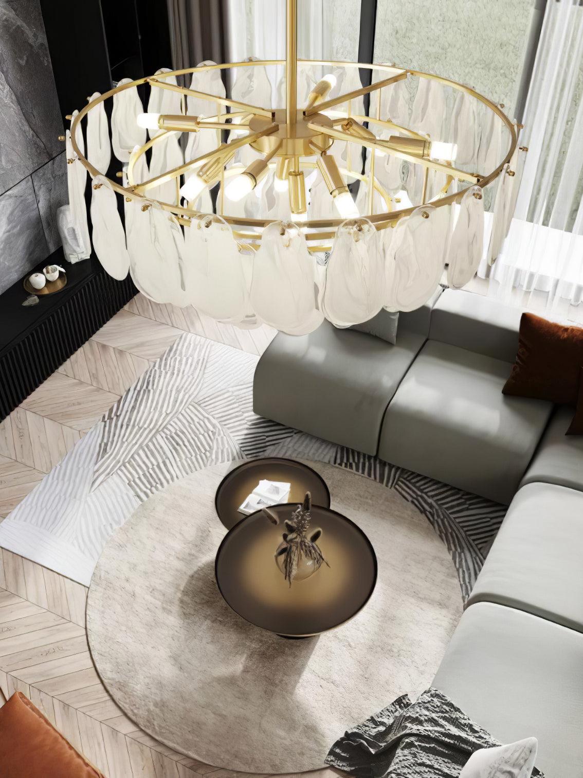 View from above of Round Cloud glass rings over a living-room sofa and round coffee tables