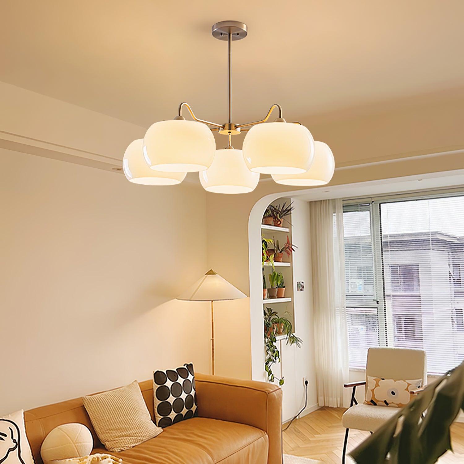 Persimmon chandelier with white glass shades and curved nickel-tone arms