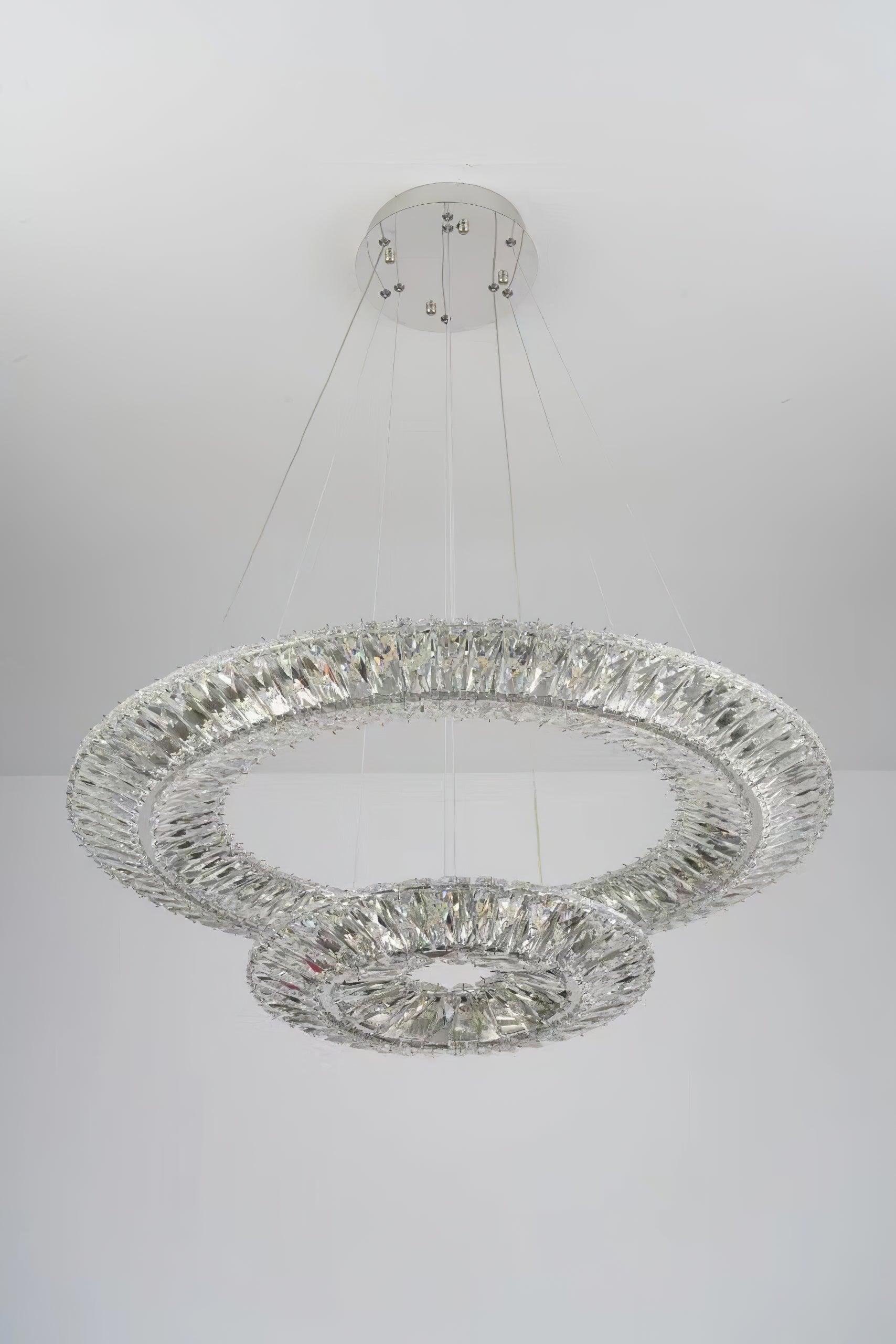 Unlit two-tier crystal arrangement below a white ceiling