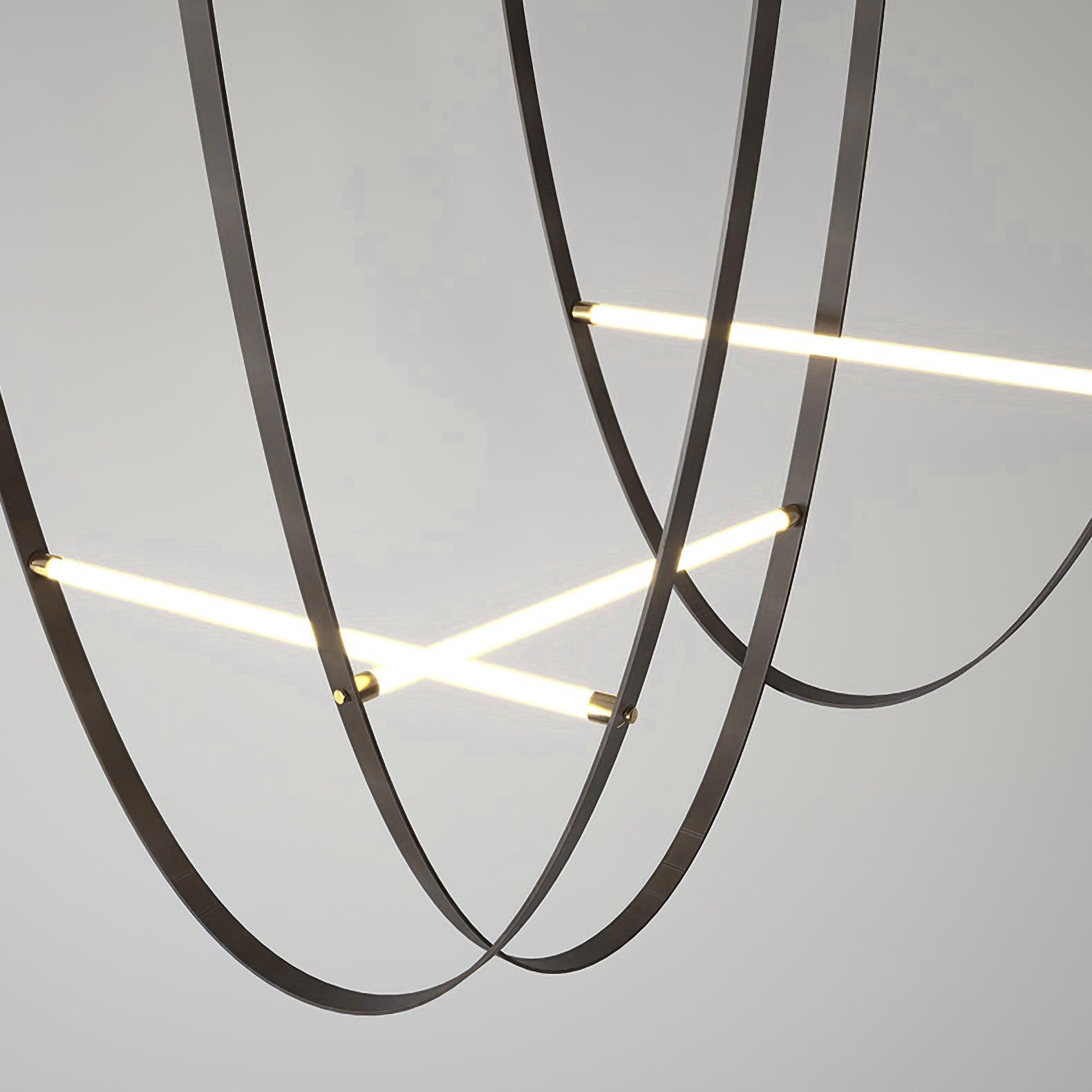 Three black U-shaped belts with straight illuminated bars and gold-tone connectors