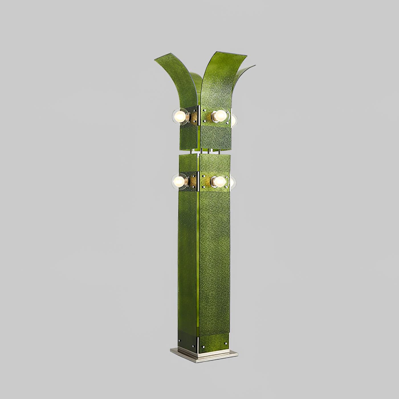 Full Green Palm Tree floor lamp isolated on grey, with angled textured panels, outward crown, round white lights and stepped base