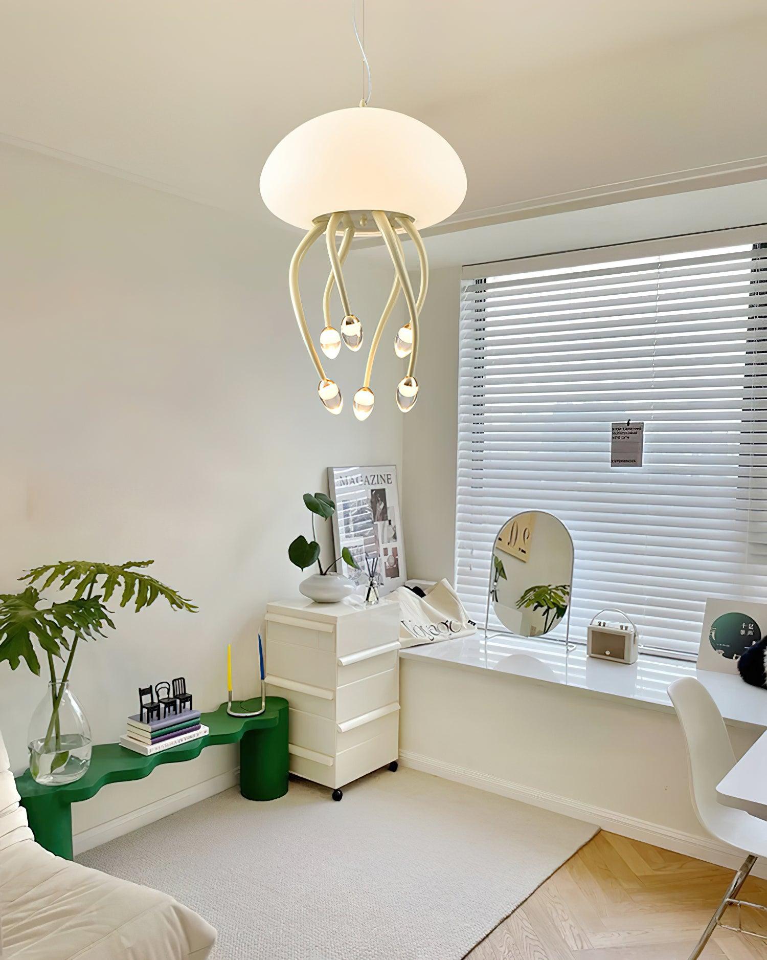 Related beige Jellyfish pendant light suspended above white desk near window blinds, mirror, green bench and plants.