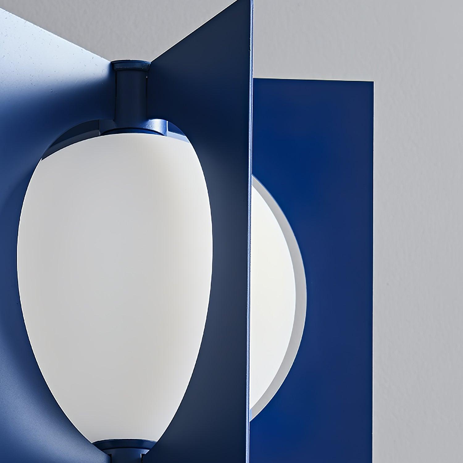 Close-up of an unlit white convex shade between blue metal fins and blue fittings