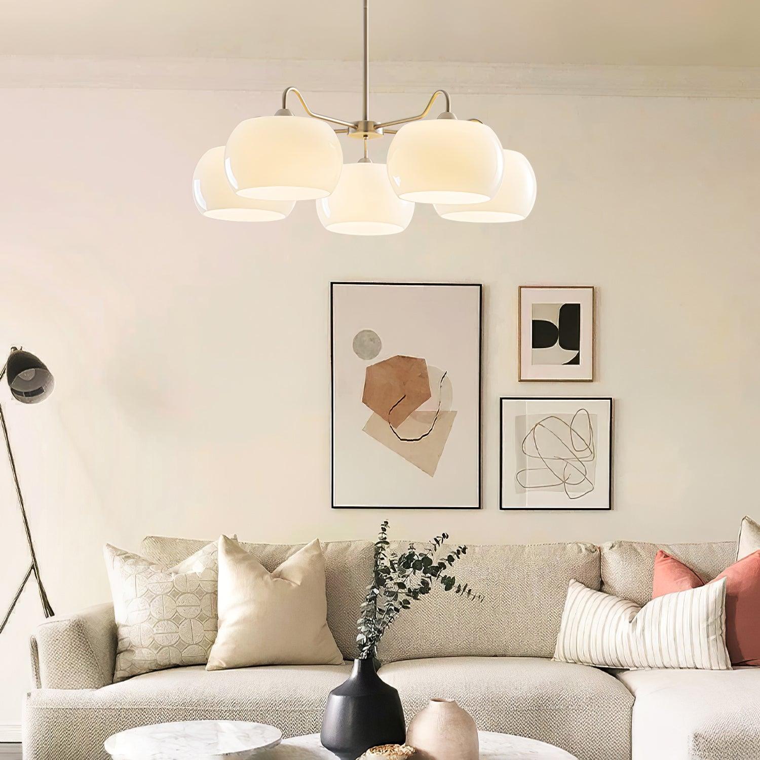 Persimmon chandelier with white glass shades and curved nickel-tone arms