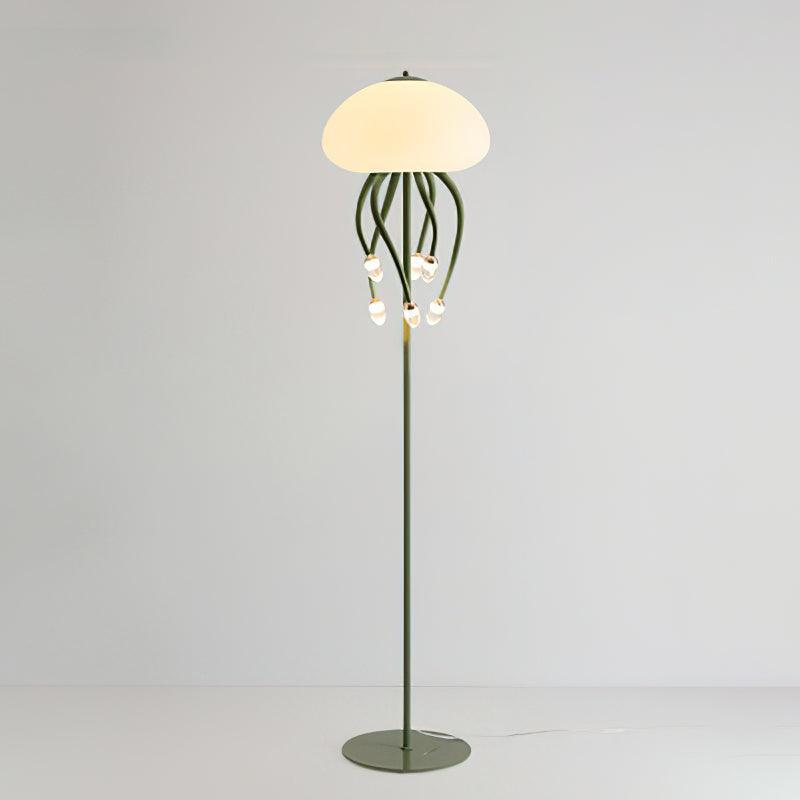Green 6+1 Jellyfish floor lamp on pale background, with six droplet-tipped arms beneath dome, slim stem and circular base.