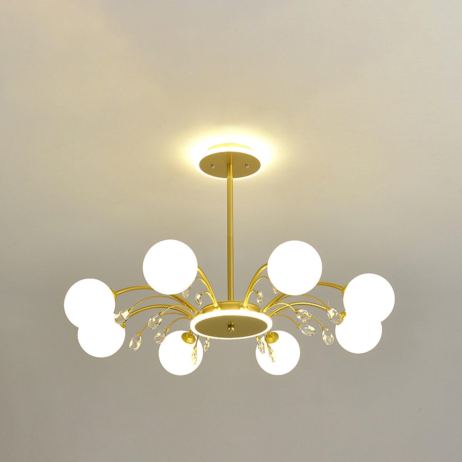Eight-light Gold version with white globes, clear drops and curved arms around a circular hub, listed at 80 cm diameter