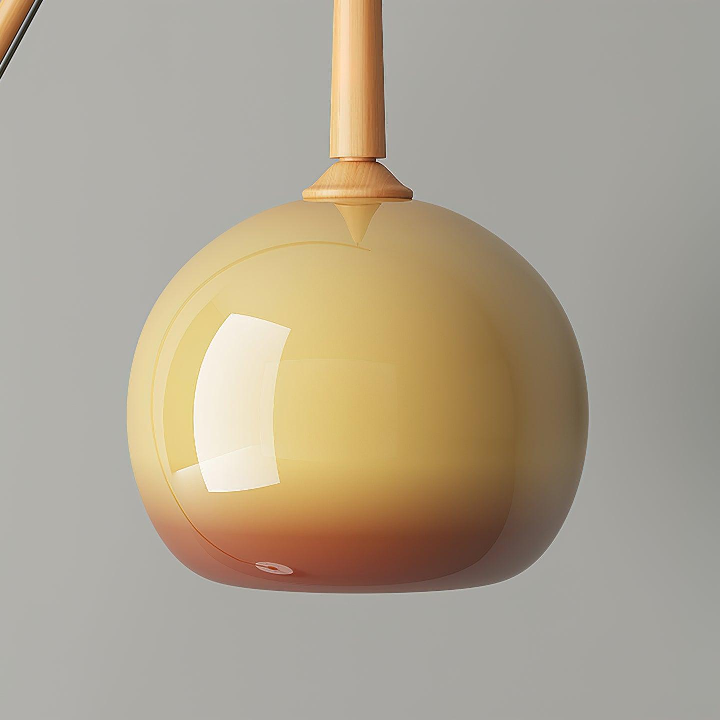 Close view of rounded orange glass and a natural wood-colour tapered neck, showing reflections and a deeper orange lower edge