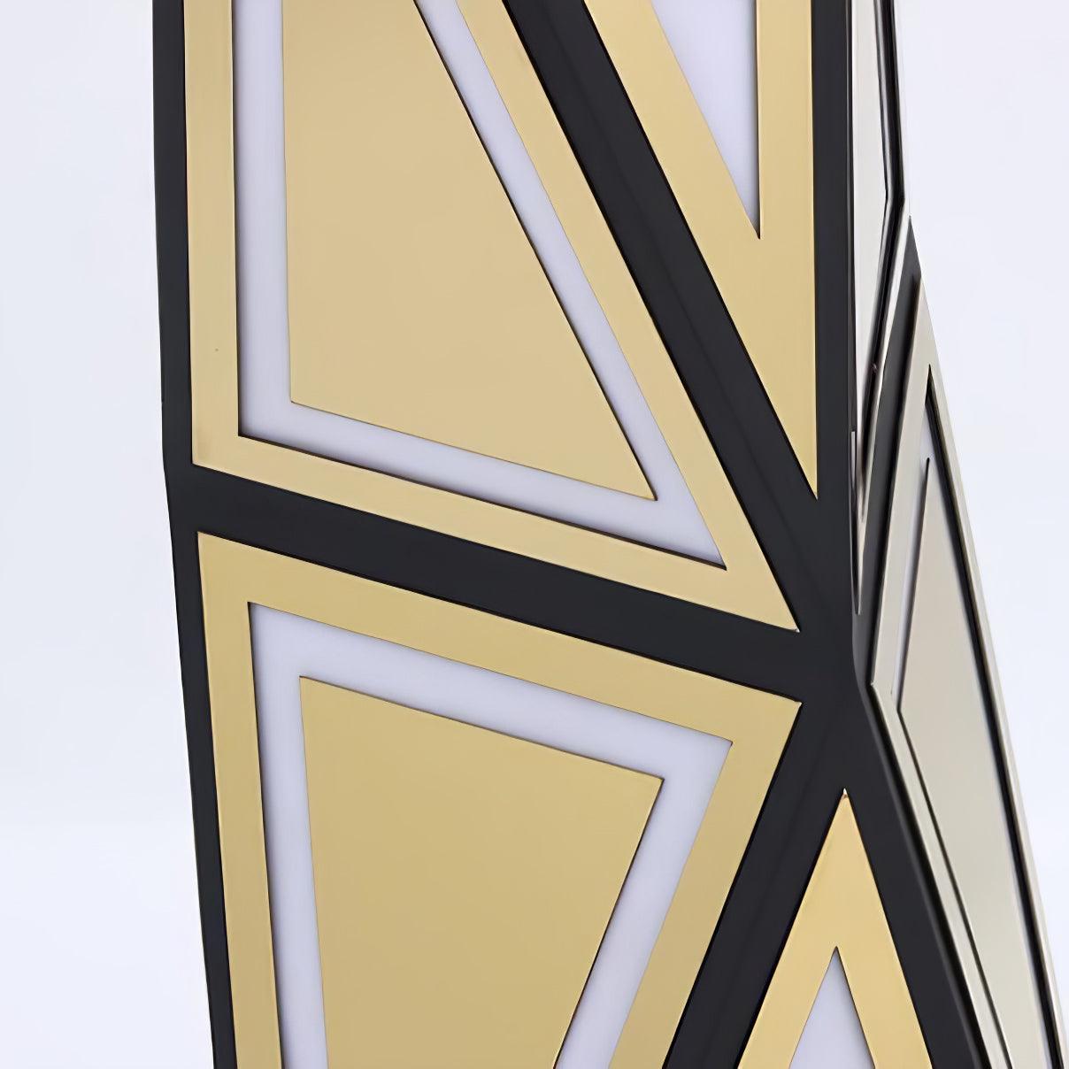 Unlit close view of gold triangular panels, white inset outlines and black diagonal ribs