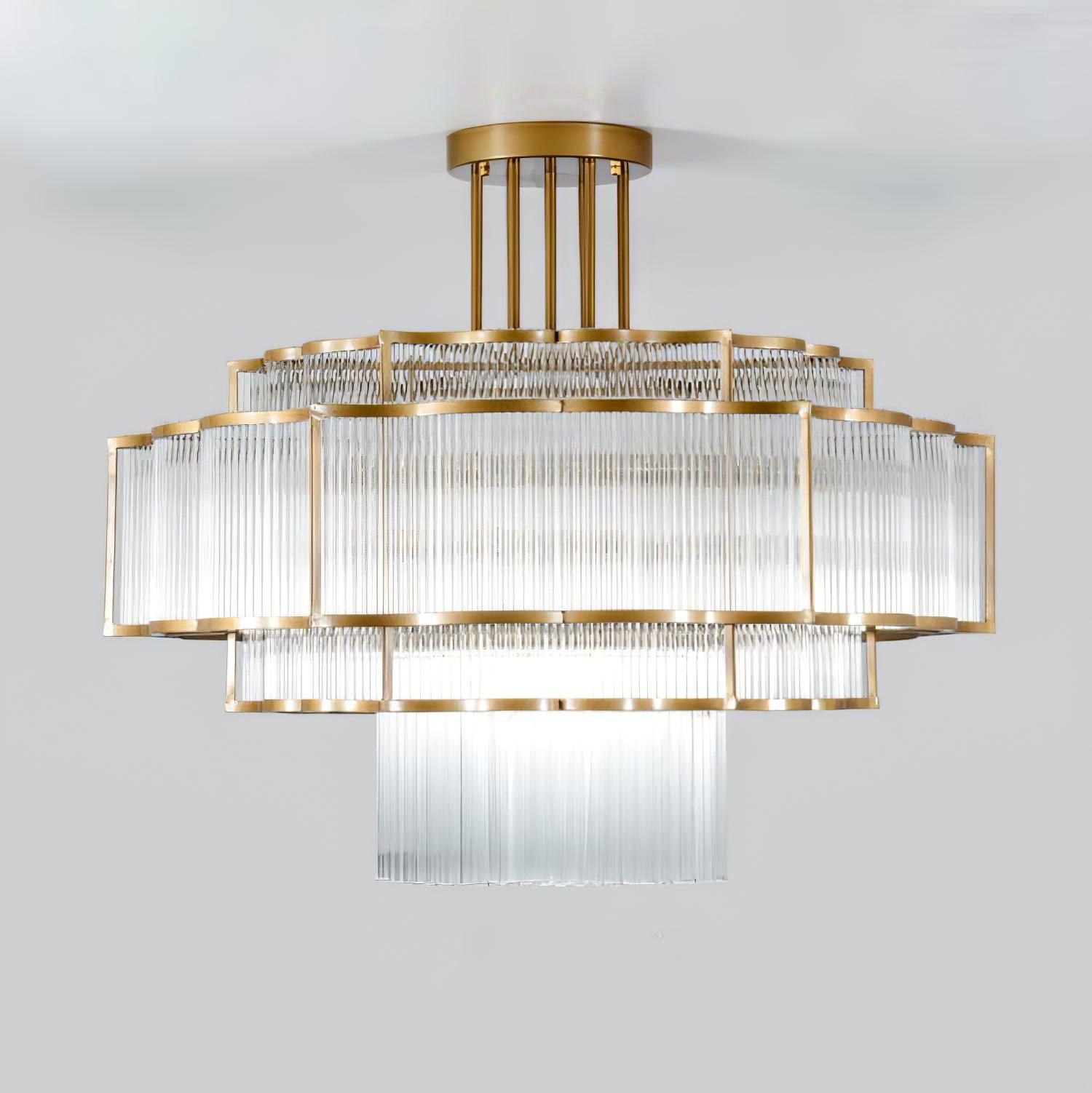 Pharo II tiered chandelier with clear ridged elements and a scalloped metal frame