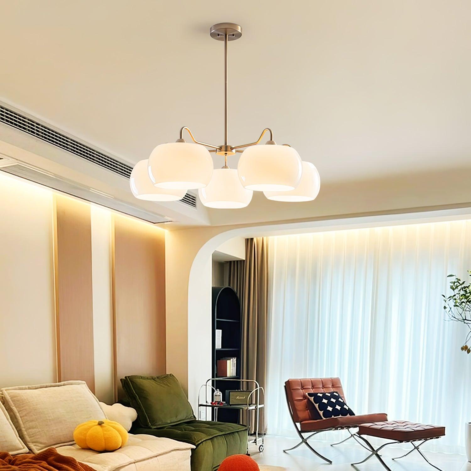 Persimmon chandelier with white glass shades and curved nickel-tone arms
