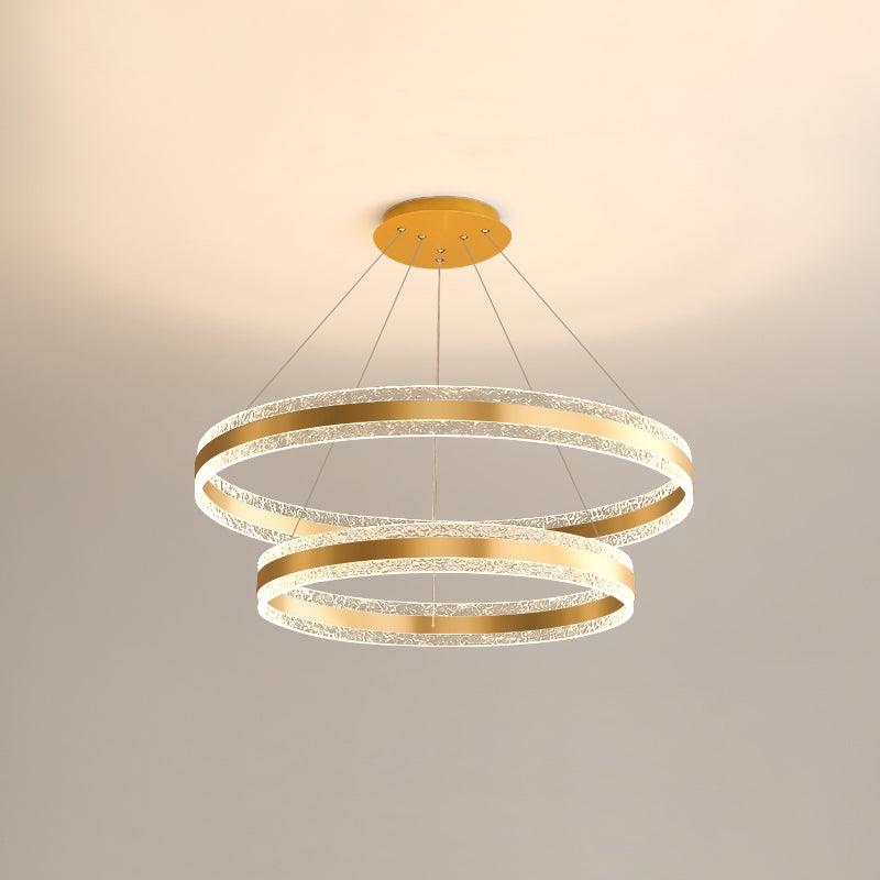 Double-layer Gold option showing two gold-tone centre-band rings with textured illuminated edges and round canopy