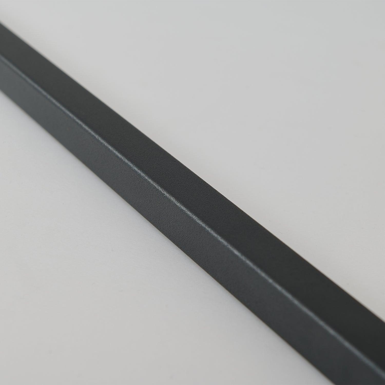 Macro of the textured matte-looking black finish on a metal section of the floor lamp