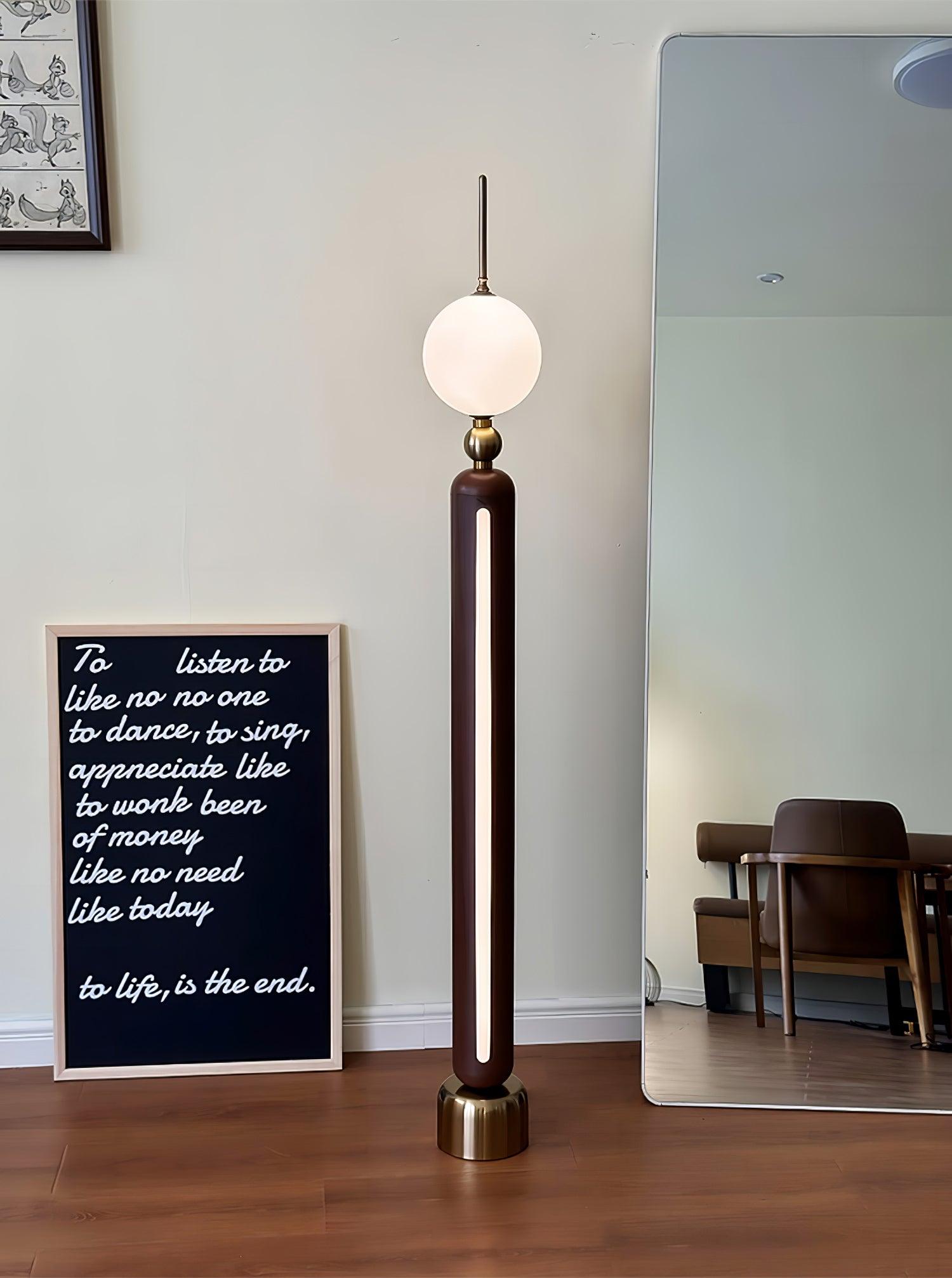 Lightning Rod chrome floor lamp with a white globe and vertical light strip
