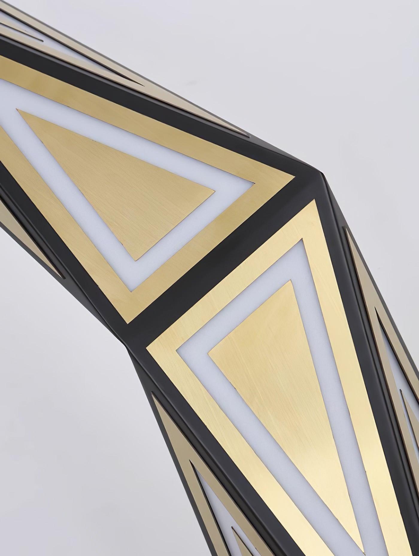 Angled close view of gold triangular panels and white light outlines within a black frame